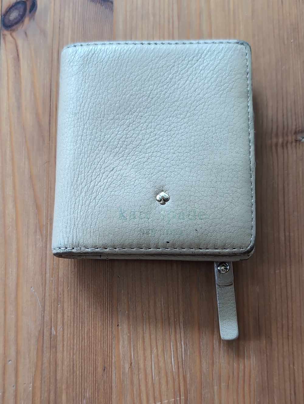 kate spade pebble leather zip wallet in beige